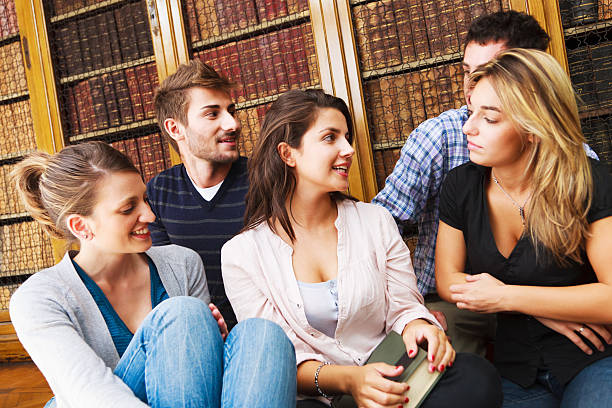 Friendship Group of Students together in University Library