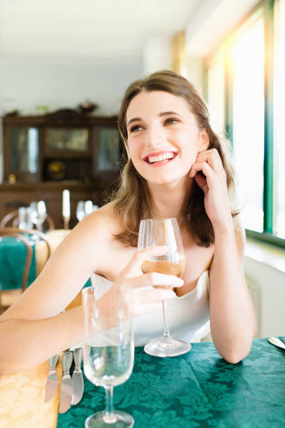 Cheerful Young Woman Dating in Restaurant