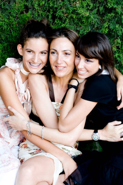 happy mother and her daughters