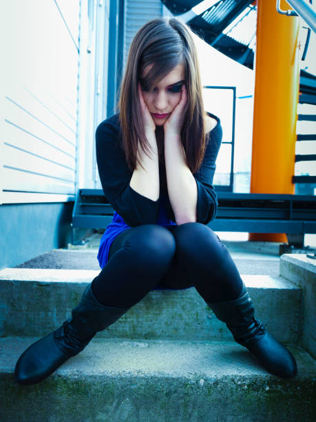 Sadness Young Woman Head in Hands