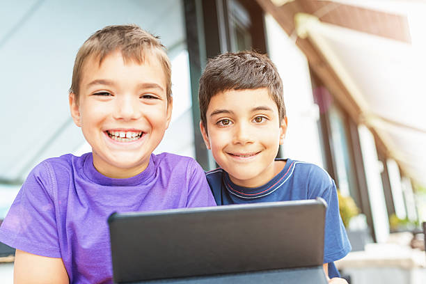 Boys Playing with Tablet PC