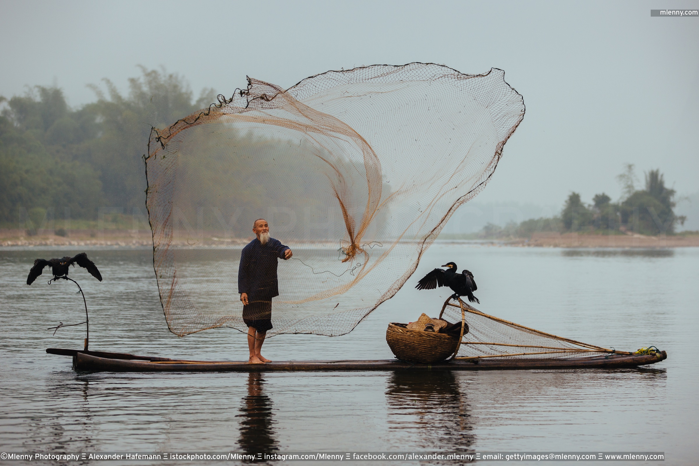 Chinese traditional senior fisherman throwing fishing net Li River, China -  Mlenny Photography Travel, Nature, People & AI