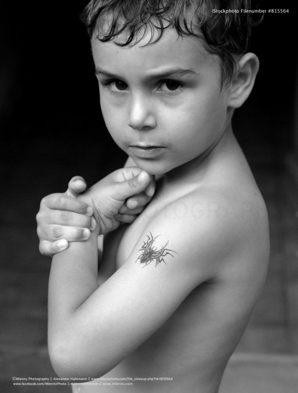 Little Boy Showing off Temporary Tattoo